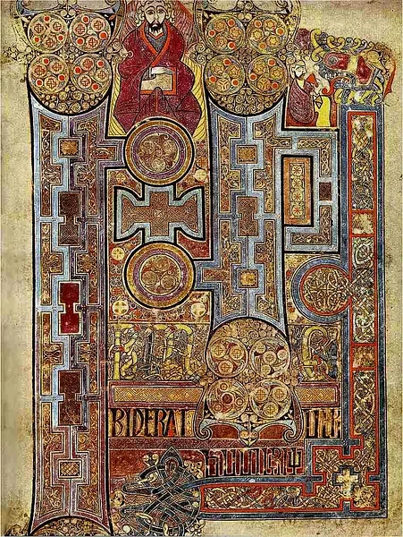 Illuminated manuscript page from the Book of Kells showing intricate Celtic knotwork and vivid pigments